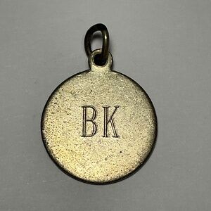 Tiffany and Co. Round with initials B K Pendant. 3/4 inch diameter